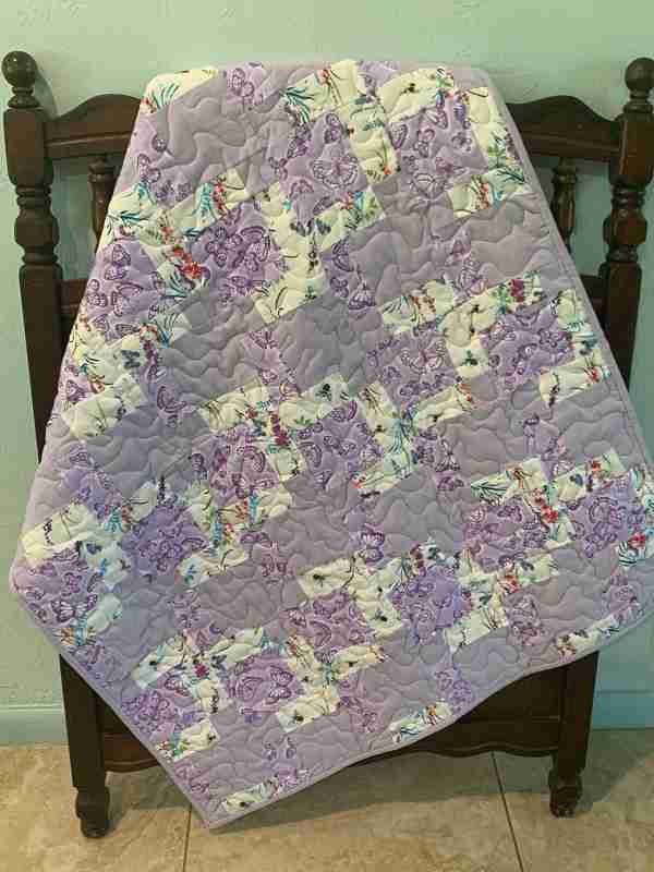 quilt with lilac butterflies