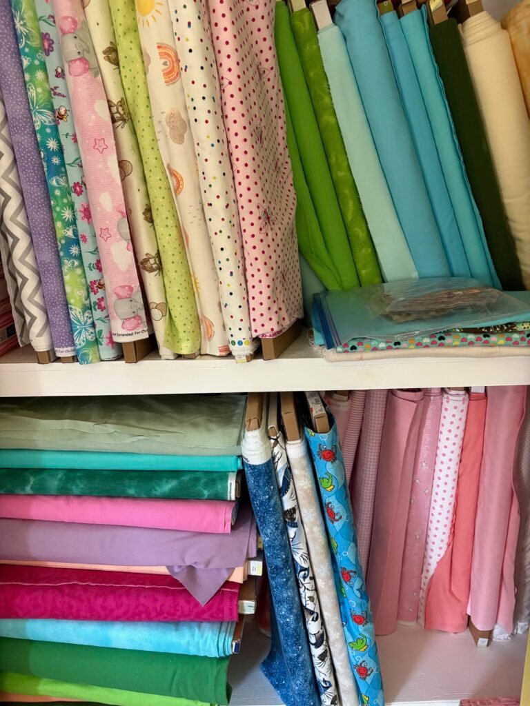 fabric bolts on a shelf